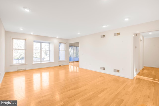 spare room featuring light wood-type flooring