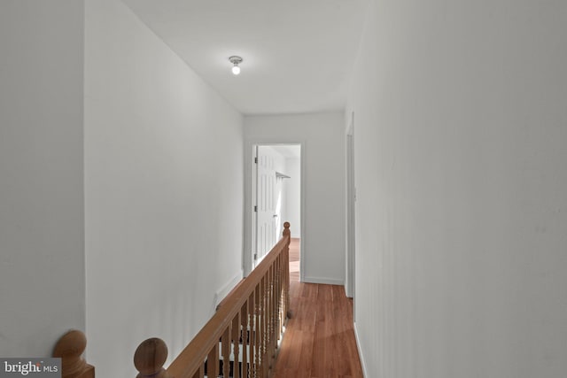 hall with hardwood / wood-style floors