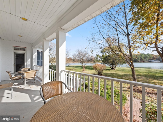 balcony with a porch and a water view