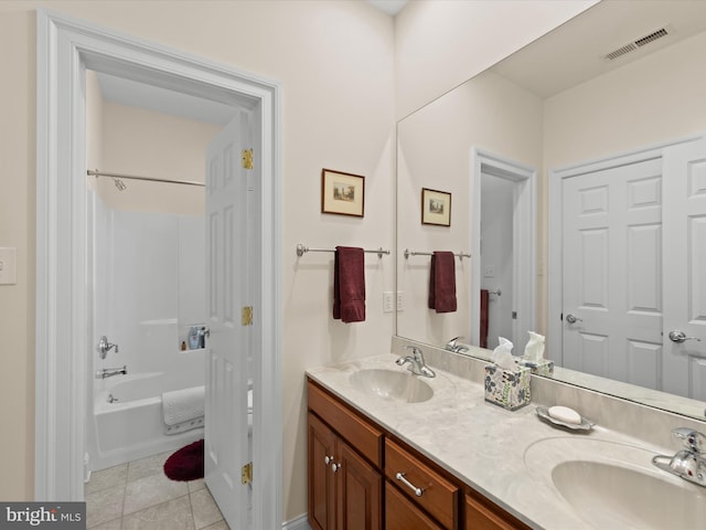 bathroom with tile patterned floors, shower / washtub combination, and vanity