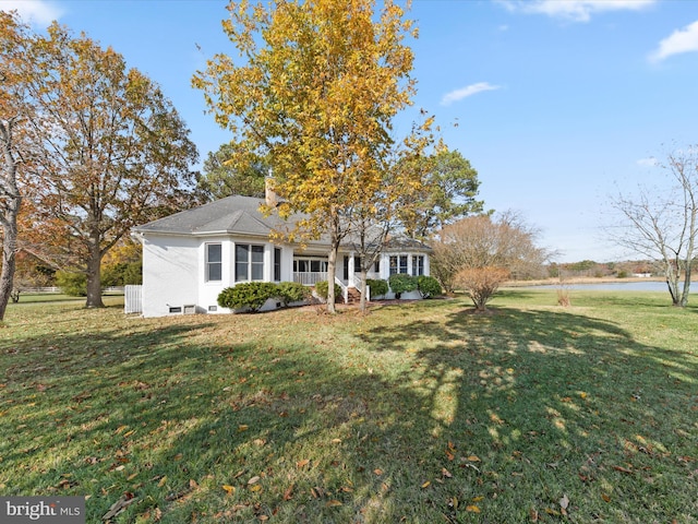 7369 Drum Point Rd, Saint Michaels, MD 21663 - single story home with a front yard, a water view, covered porch, and a chimney