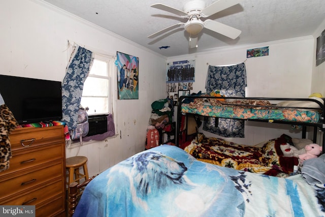 bedroom with a textured ceiling, ceiling fan, cooling unit, and crown molding