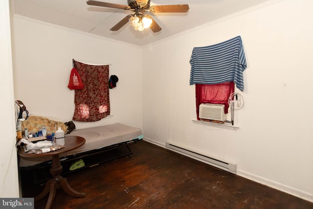 living area featuring dark hardwood / wood-style flooring, crown molding, and baseboard heating