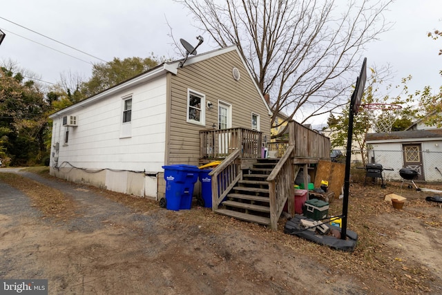 view of side of home with a deck