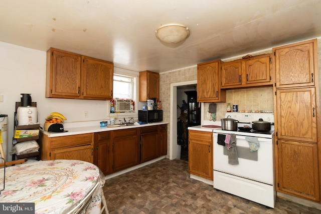 kitchen with electric stove and sink