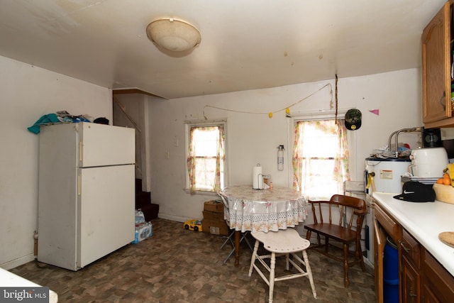 kitchen featuring white refrigerator and water heater