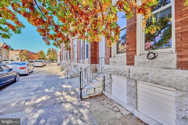 235 N Luzerne Ave N, Baltimore, MD 21224 - view of side of home featuring brick siding