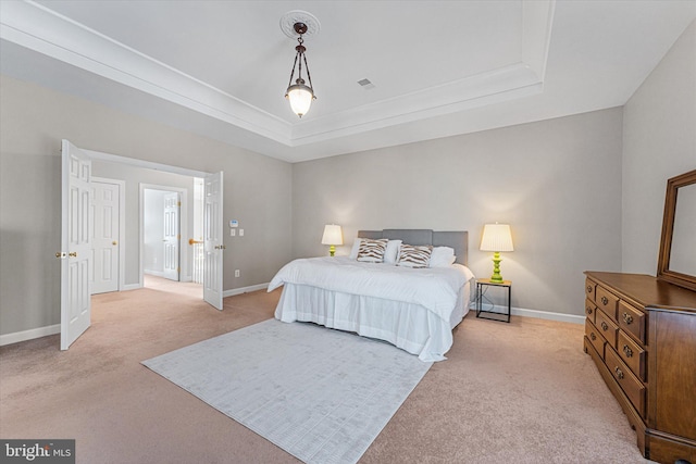 carpeted bedroom featuring a raised ceiling