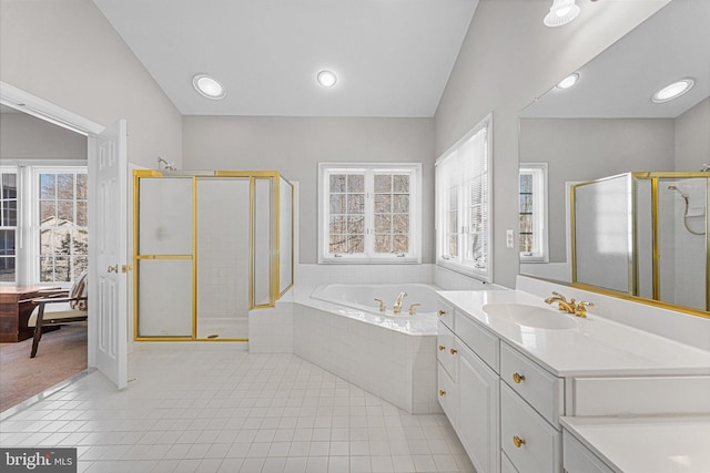 bathroom featuring plus walk in shower, tile patterned floors, and vanity