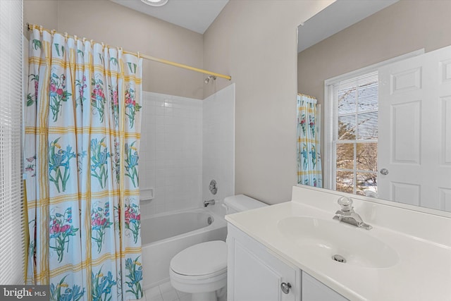 full bathroom with vanity, shower / bath combo, and toilet