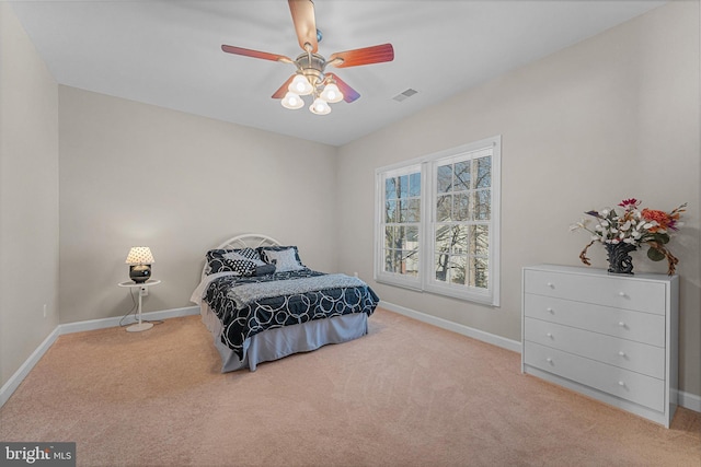 bedroom with light carpet and ceiling fan