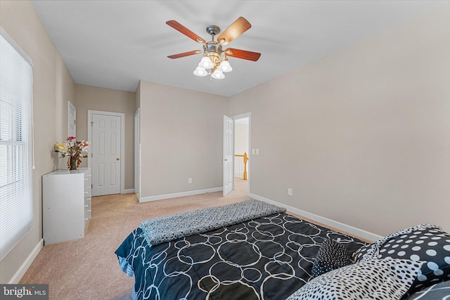 bedroom with light carpet and ceiling fan