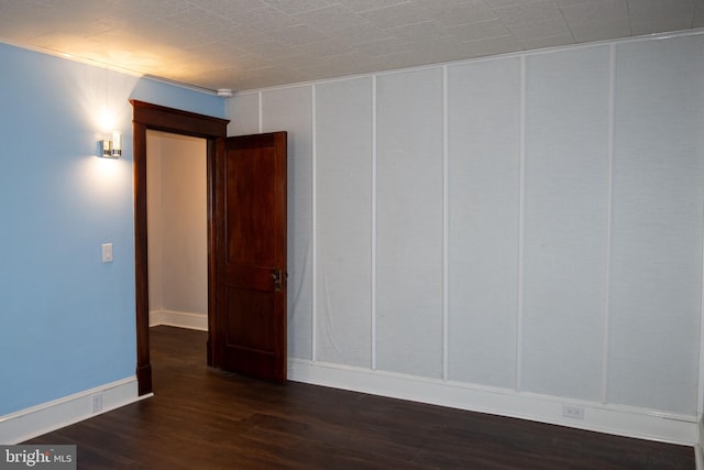 unfurnished room featuring dark hardwood / wood-style floors