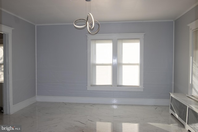 spare room featuring radiator and ornamental molding