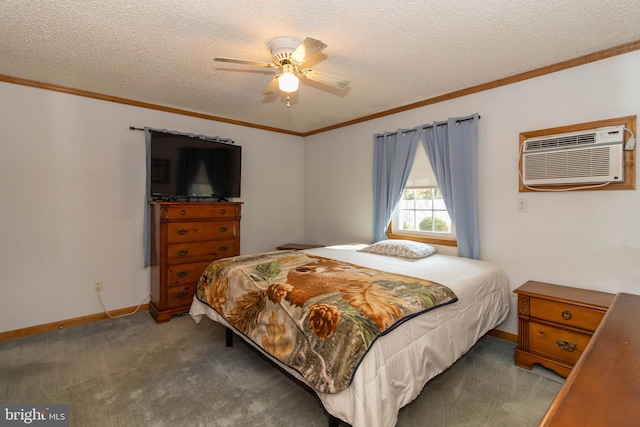 carpeted bedroom with an AC wall unit, ceiling fan, a textured ceiling, and ornamental molding