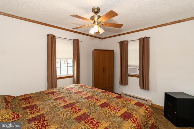 bedroom featuring ornamental molding, a textured ceiling, ceiling fan, and a baseboard heating unit