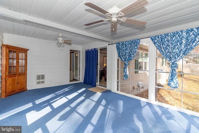 view of patio featuring heating unit and ceiling fan