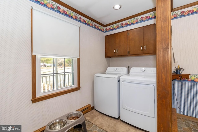 laundry room featuring cabinets and separate washer and dryer