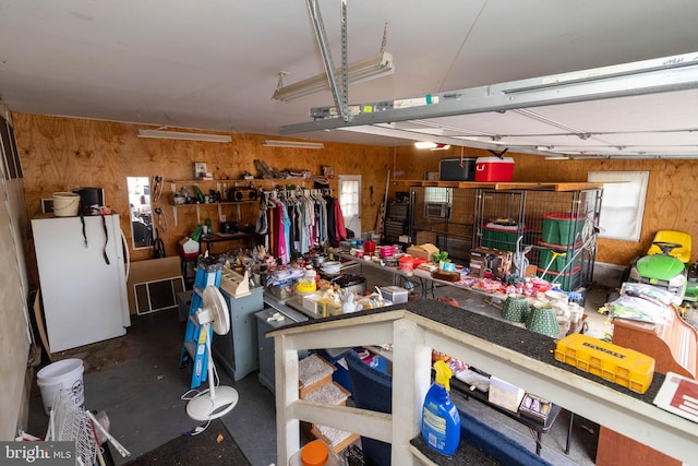 garage featuring wooden walls