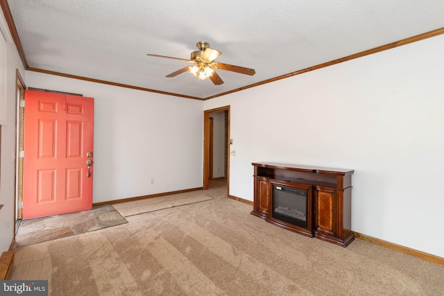 unfurnished living room featuring light carpet, a textured ceiling, ceiling fan, and crown molding