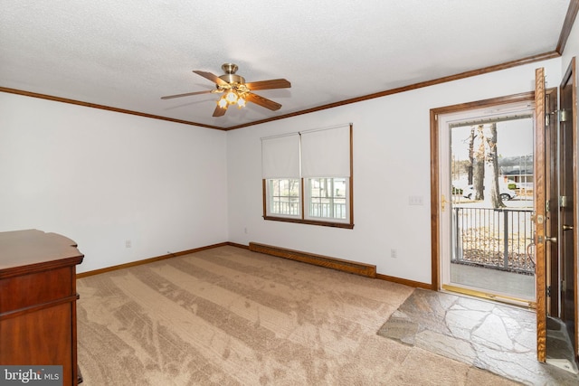 interior space featuring light carpet, ceiling fan, ornamental molding, a textured ceiling, and a baseboard radiator