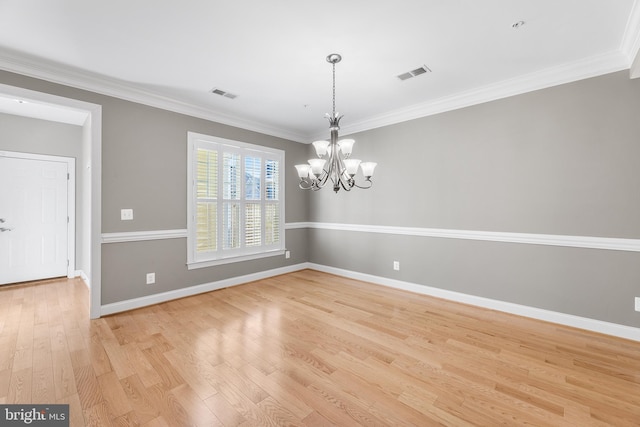 unfurnished dining area featuring a chandelier, light hardwood / wood-style flooring, and ornamental molding