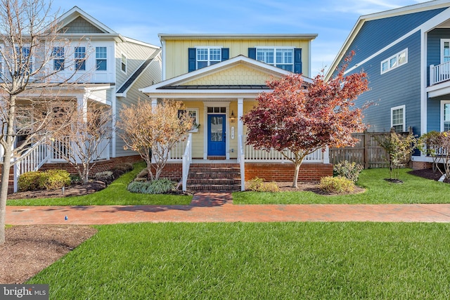 view of front of property featuring a porch and a front lawn