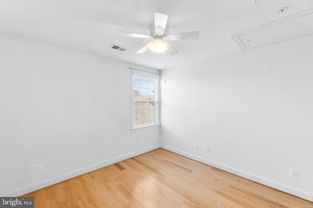 spare room with ceiling fan and hardwood / wood-style floors