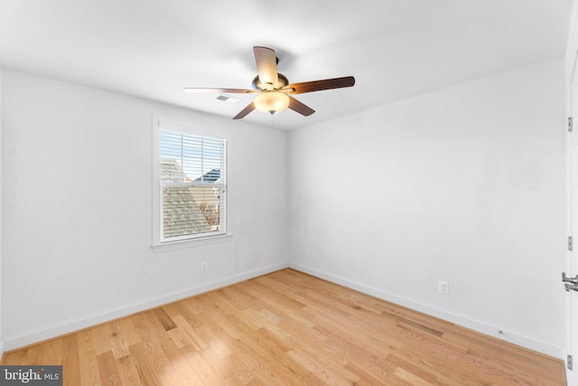 spare room with ceiling fan and light hardwood / wood-style flooring