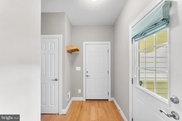 doorway with light hardwood / wood-style flooring