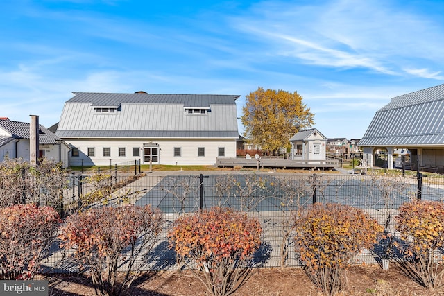 rear view of property with a wooden deck