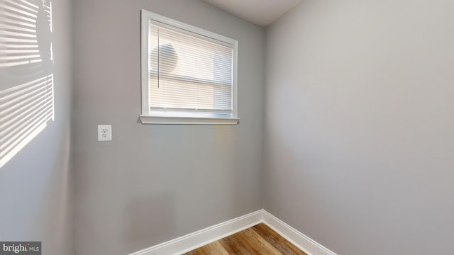 spare room featuring hardwood / wood-style flooring