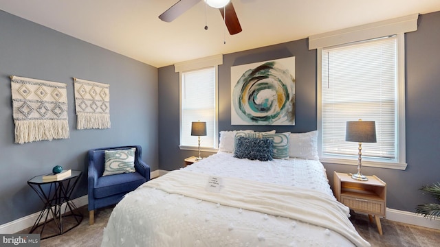 carpeted bedroom featuring ceiling fan