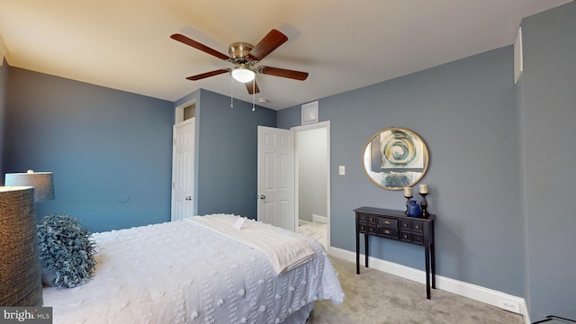 bedroom featuring ceiling fan and light carpet