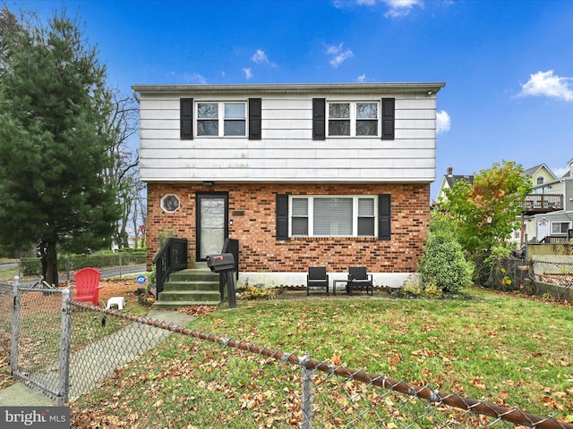 front of property featuring a front yard