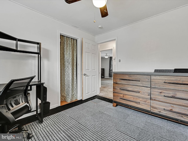 bedroom featuring ceiling fan and dark colored carpet