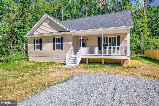 view of front facade with a front lawn and a porch