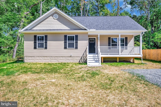 view of front facade with covered porch and a front yard