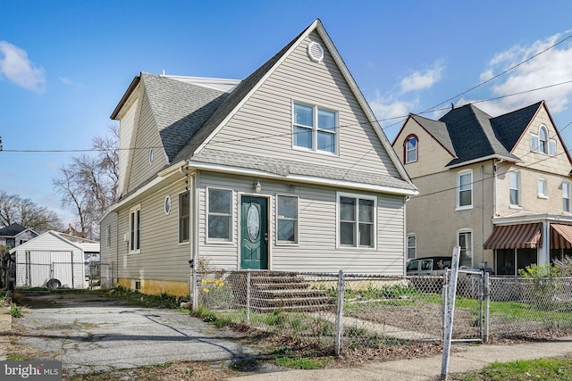 61 Belmont Ave, Wilmington, DE 19804 - view of front of home with a fenced front yard, a shingled roof, and a gate