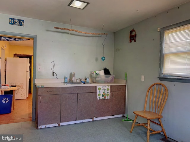 kitchen with white refrigerator and sink