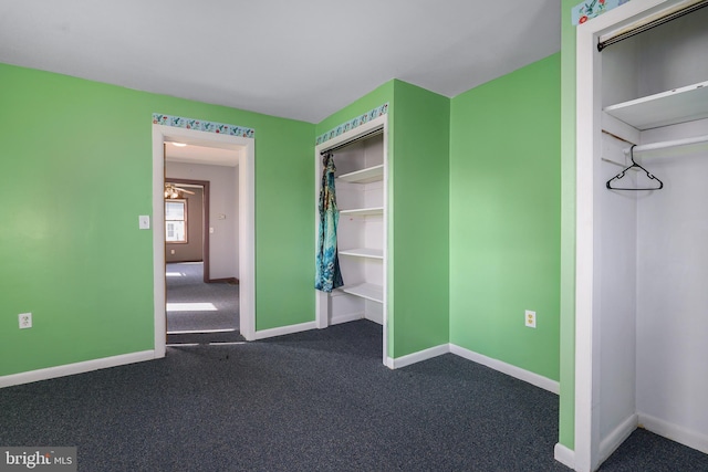 61 Belmont Ave, Wilmington, DE 19804 - unfurnished bedroom featuring dark colored carpet, baseboards, and a closet