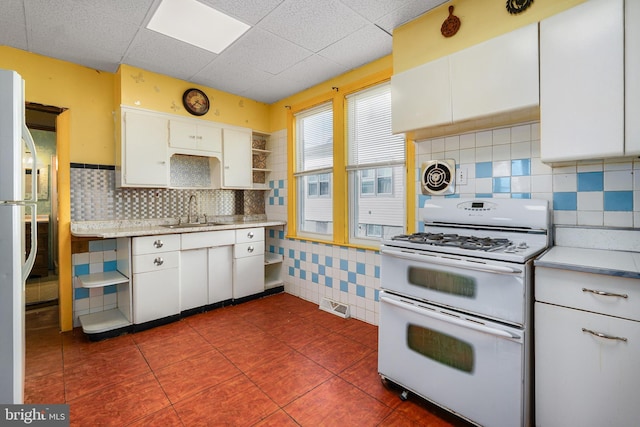 61 Belmont Ave, Wilmington, DE 19804 - kitchen featuring double oven range, open shelves, a sink, white cabinets, and light countertops