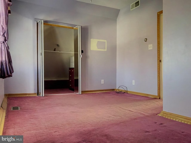 empty room with carpet flooring