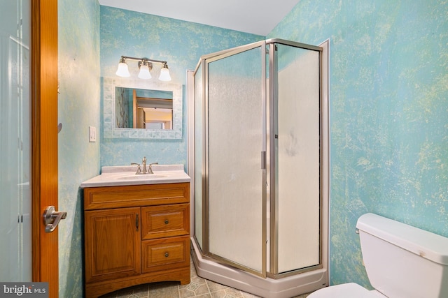 61 Belmont Ave, Wilmington, DE 19804 - full bathroom featuring wallpapered walls, a shower stall, vanity, and toilet