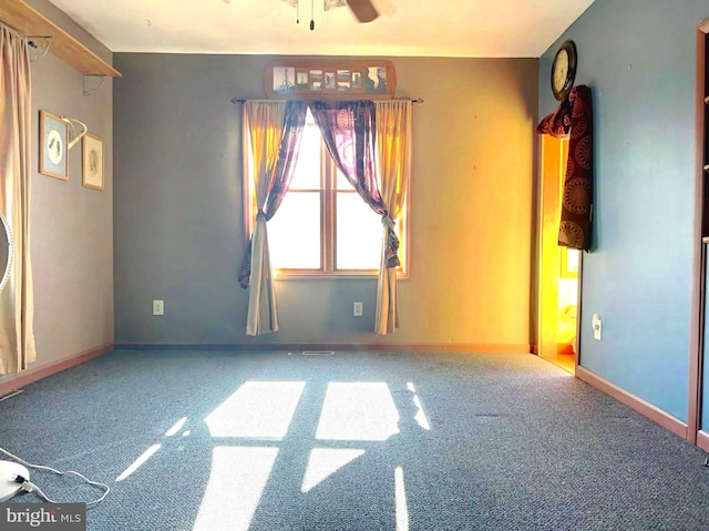 carpeted empty room with ceiling fan