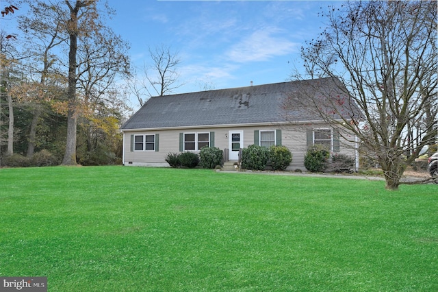 back of house with a yard