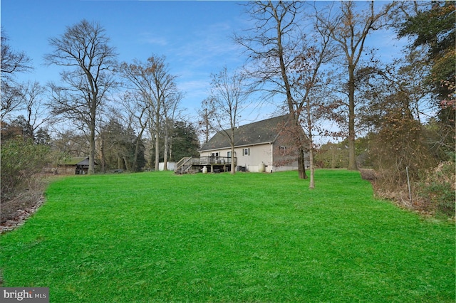 view of yard featuring a wooden deck