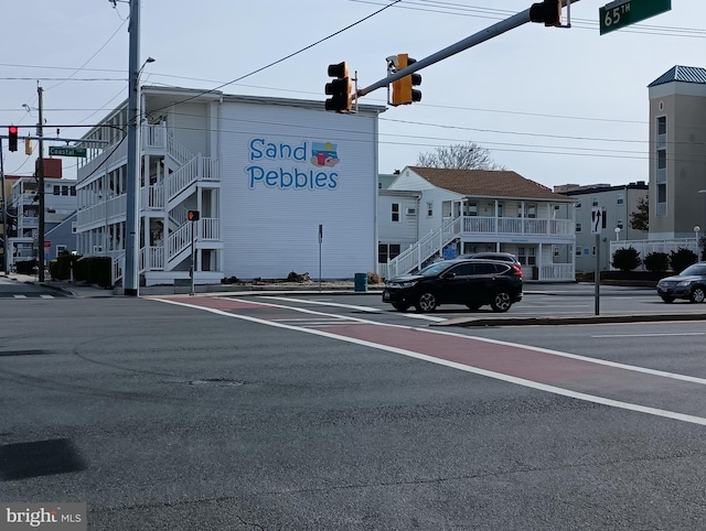 6406 Coastal Hwy Unit 201, Ocean City, MD 21842 - view of asphalt road featuring traffic lights, street lights, traffic signs, sidewalks, and curbs