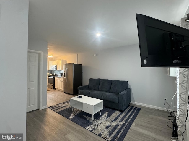 6406 Coastal Hwy Unit 201, Ocean City, MD 21842 - living area with light wood-style floors and baseboards