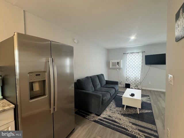 6406 Coastal Hwy Unit 201, Ocean City, MD 21842 - living area with wood finished floors and an AC wall unit